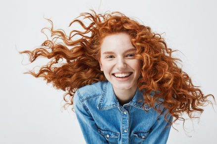 smiling woman with red hair